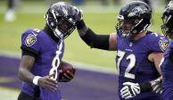 Jugadores de los Ravens festejan un touchdown contra los Giants en la Semana 15 de la NFL.