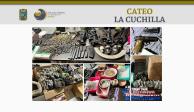 Cartuchos, granadas, armas largas y drogas fueron confiscadas por la policía en el mercado La Cuchilla, ayer.