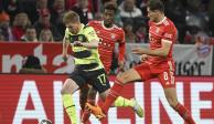 Kevin De Bruyne intenta dejar atrás a Leon Goretzka y a Kingsley Coman en el juego de vuelta entre Bayern Múnich y Manchester City.
