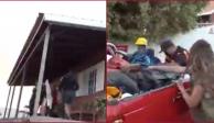 En un video difundido en redes sociales se observa cómo los reporteros se apresuran a ayudar a una familia que busca salvar sus pertenencias del desastre natural