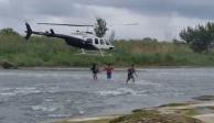 Helicóptero detiene avance de migrantes en Coahuila