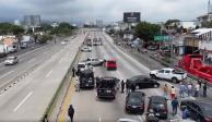 Durante enfrentamiento a balazos en la autopista México-Cuernavaca detienen a dos personas armadas