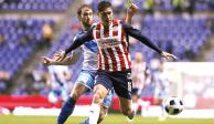 Jugadores de Chivas y Puebla en el último partido en el Cuauhtémoc.