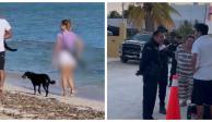 Mujer es captada caminando en playas de Yucatán con arma larga.