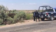 Elementos de la Policía Municipal acordonaron la zona en donde fue hallado el cadáver de la víctima, ayer.