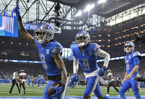 Jugadores de Lions festejan un touchdown en los playoffs.