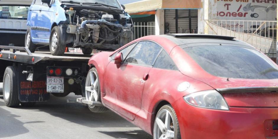 Hallan autos robados en taller mecánico de Cancún