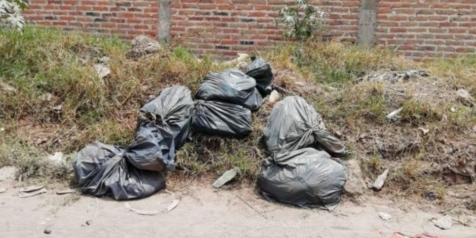 Encuentran 15 bolsas con restos humanos en brecha de Tlaquepaque