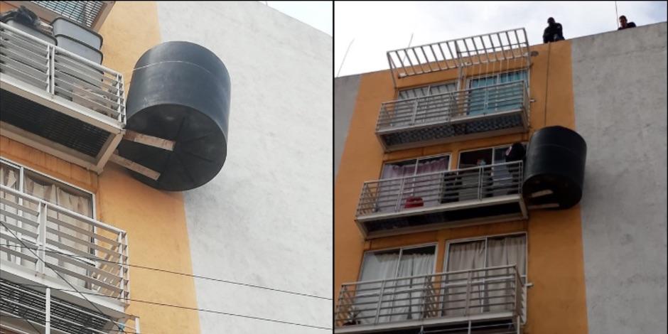 Vecinos colocan tinaco en un balcón. Foto: Especial
