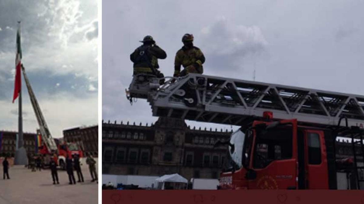 Viento enreda bandera monumental en el Zócalo; bomberos acuden a liberarla