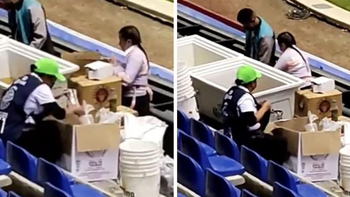 Captan a vendedora de cervezas limpiando vasos con mandil en estadio del Puebla (VIDEO)